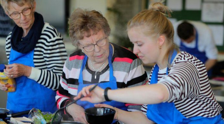 Foto met daarop de deelnemers aan de workshop Koken op inductie